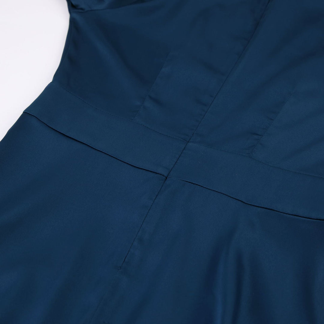 Women's flattering dark blue party dress, elegant midi design for special events.