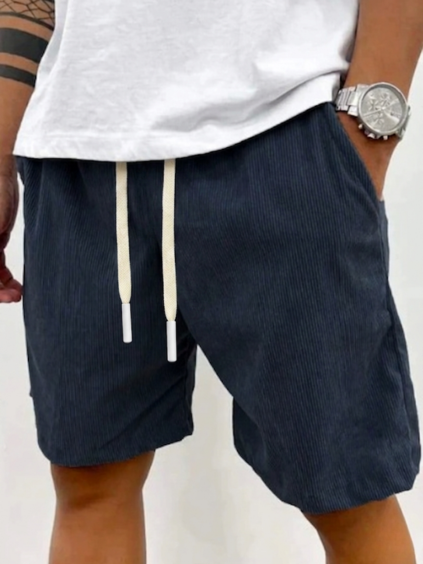 Comfortable men's knee-length relaxed fit shorts with drawstring, perfect for athletic activities or lounge wear.