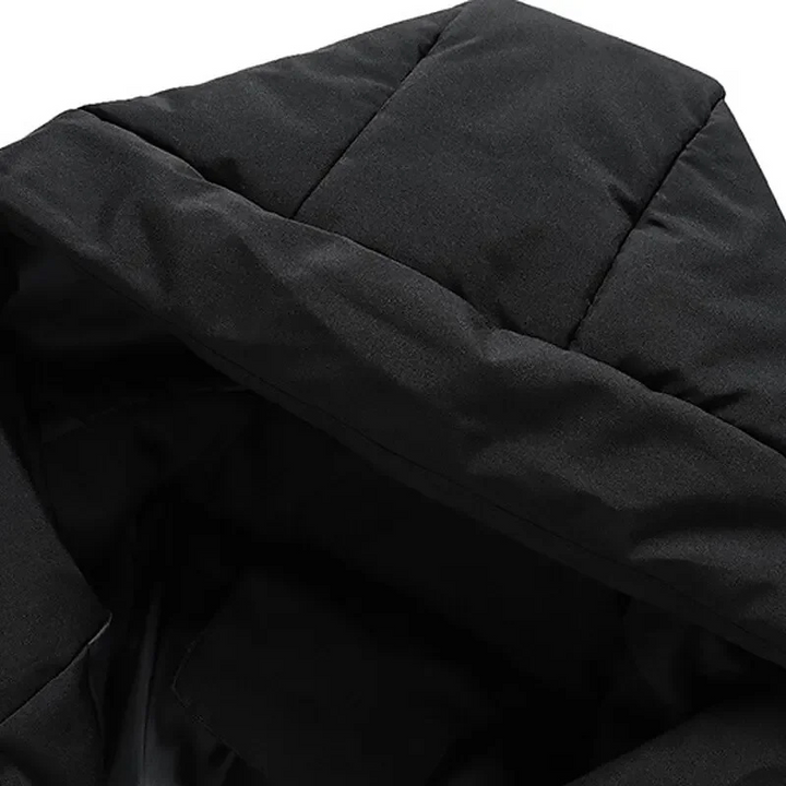 Men's navy hooded puffer jacket, quilted for warmth, great for cold weather.