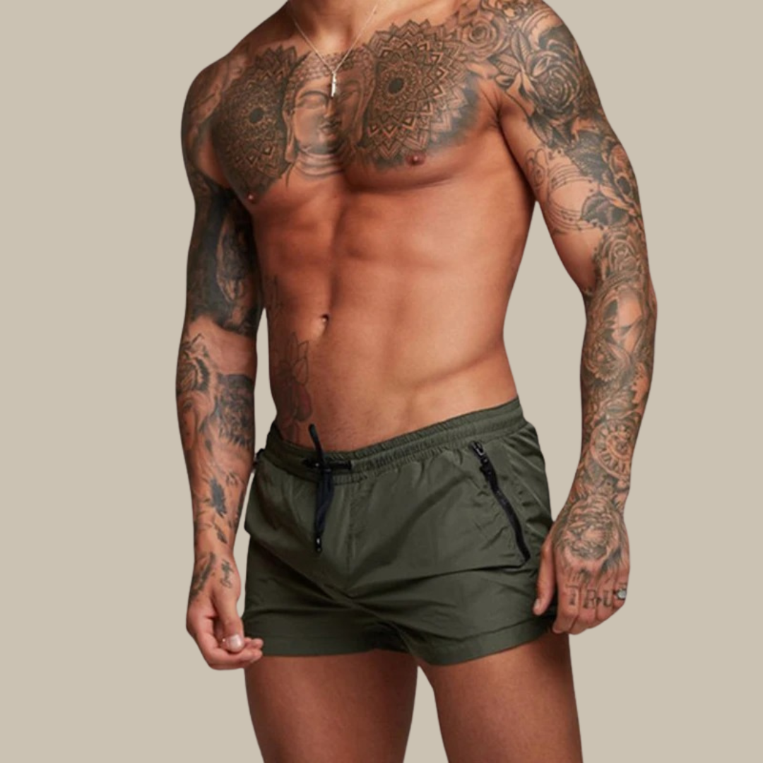 Quick-dry men's swim shorts featuring an elastic waist & practical zipper pockets for all activities.