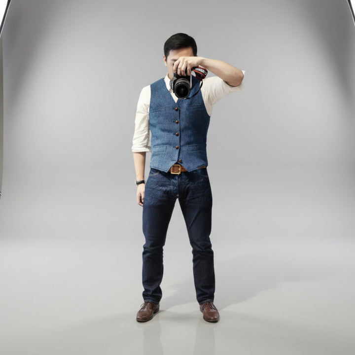 Modern men's multi-color sleeveless vest with button-up closure, versatile apparel for any season.