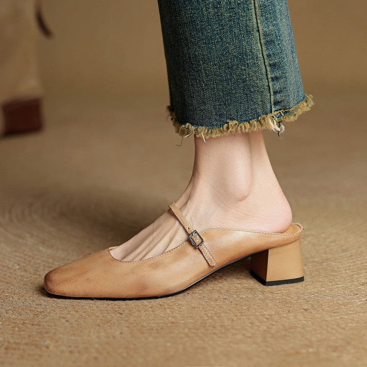 Close-up of adjustable buckle strap on comfortable womens Mary Jane mules.