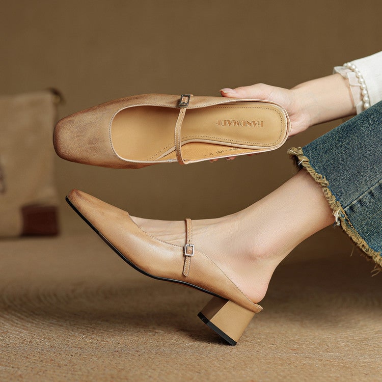 Detail of sturdy block heel on women's square toe Mary Jane slip-on mules.