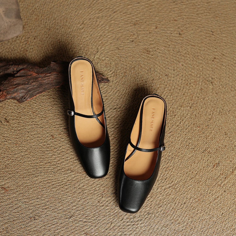 Womens Mary Jane mules, designed with a classic buckle, block heel, and square toe.