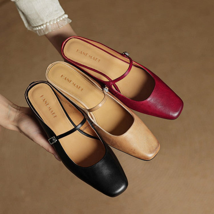 Contemporary Mary Jane mules, block heel, square toe, and an eye-catching buckle strap.