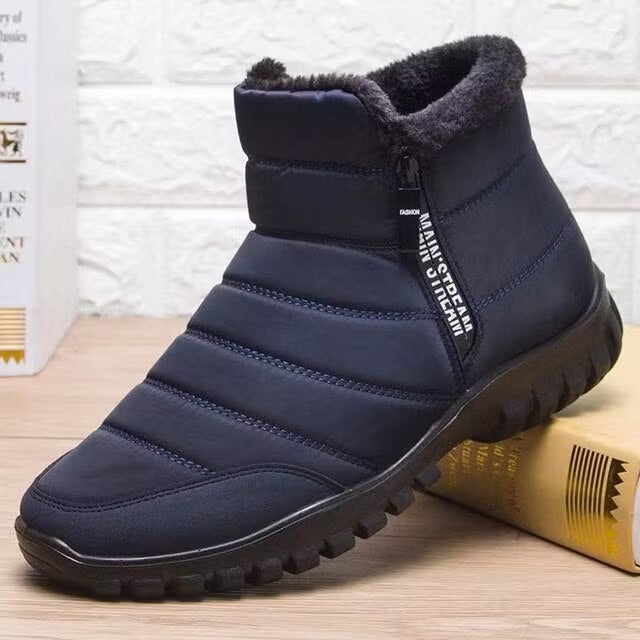 Durable men's ankle snow boots for winter activities, with convenient side zip and secure grip sole.
