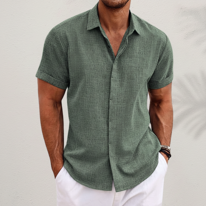 Relaxed fit men's casual button-up shirt. Short-sleeve design, perfect for effortless summer style.