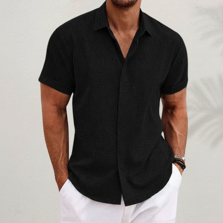 Men's casual short-sleeve button-up. Relaxed fit summer shirt for versatile menswear style.
