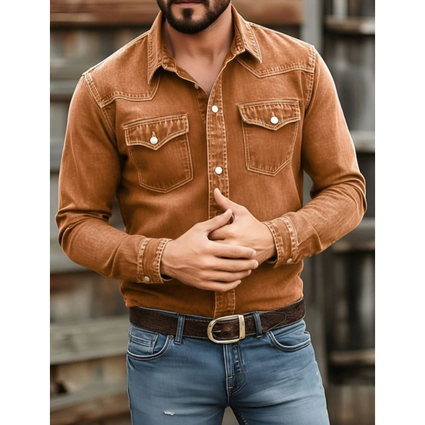 Close-up of a men's western denim shirt, highlighting the dark wash, snap buttons, and chest pocket details.