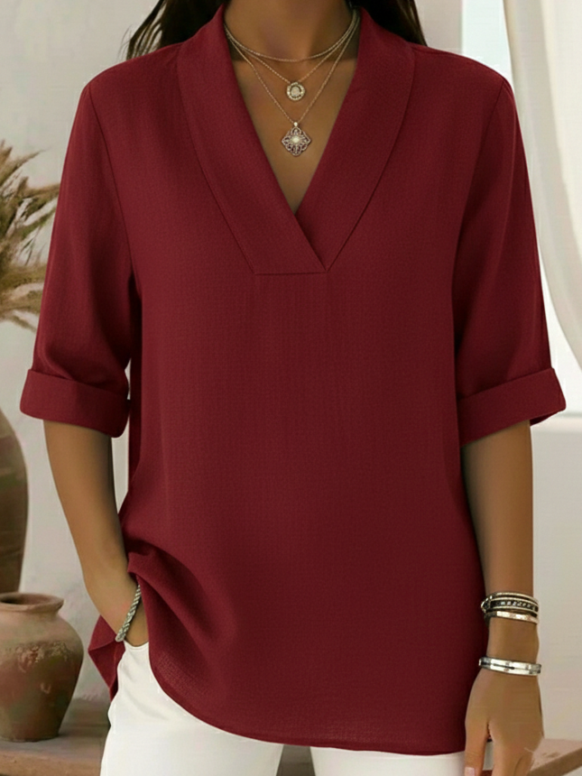 Women's effortless V-neck roll-sleeve tunic top. Relaxed fit casual blouse for everyday wear.