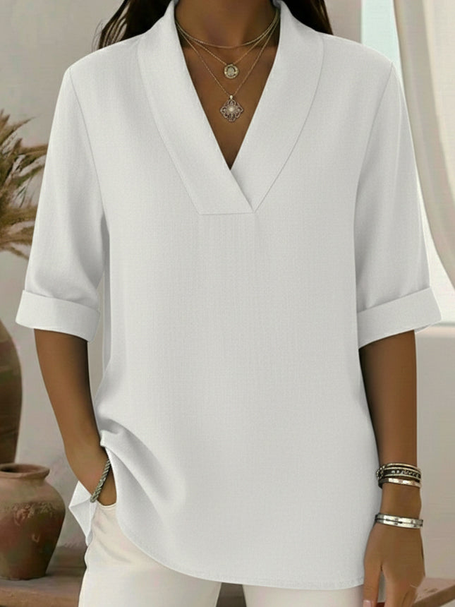 Women's V-neck blouse with roll sleeves. Stylish tunic top, great for casual or office wear.