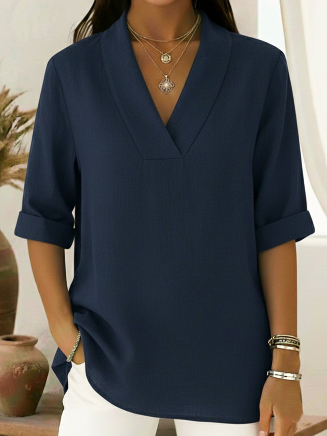 Relaxed fit women's V-neck roll-sleeve top. Effortless tunic blouse for comfortable everyday style.