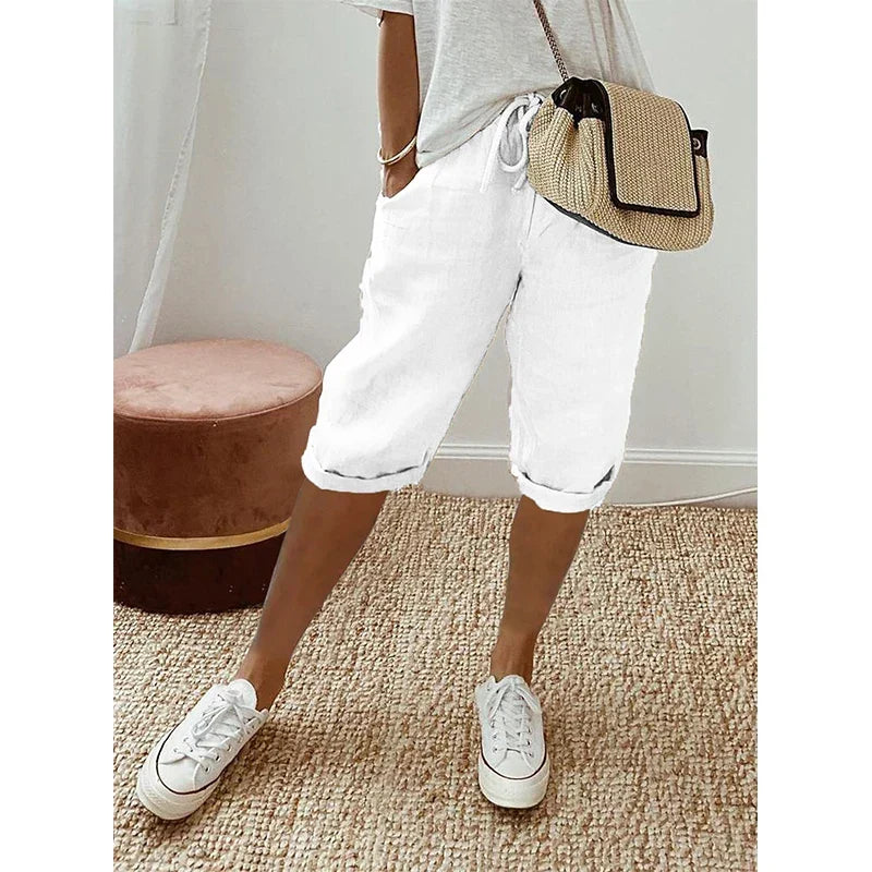 Stylish women's cropped pants with elastic drawstring waist for a comfortable, versatile summer look. Everyday elegance.