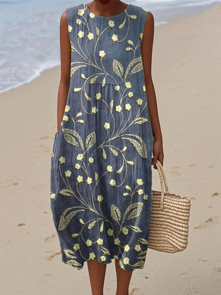 Women's blue floral sleeveless midi casual dress, perfect for summer days, spring brunch, or beach outings.