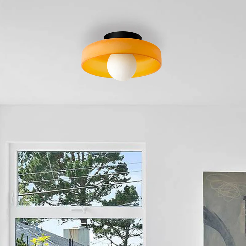 Low-profile flush mount ceiling light for modern homes. A sleek, round fixture offering versatile ambient lighting & contemporary style.
