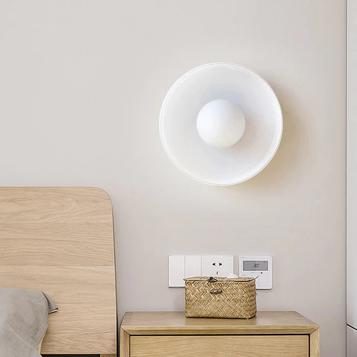 Round LED flush mount ceiling light, providing bright ambient home lighting. Sleek design for modern living room or hallway.