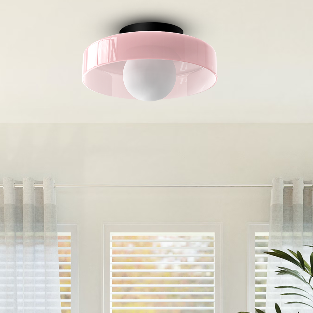Modern round flush mount ceiling light delivering soft ambient lighting. Enhances contemporary spaces like bedrooms & living rooms.