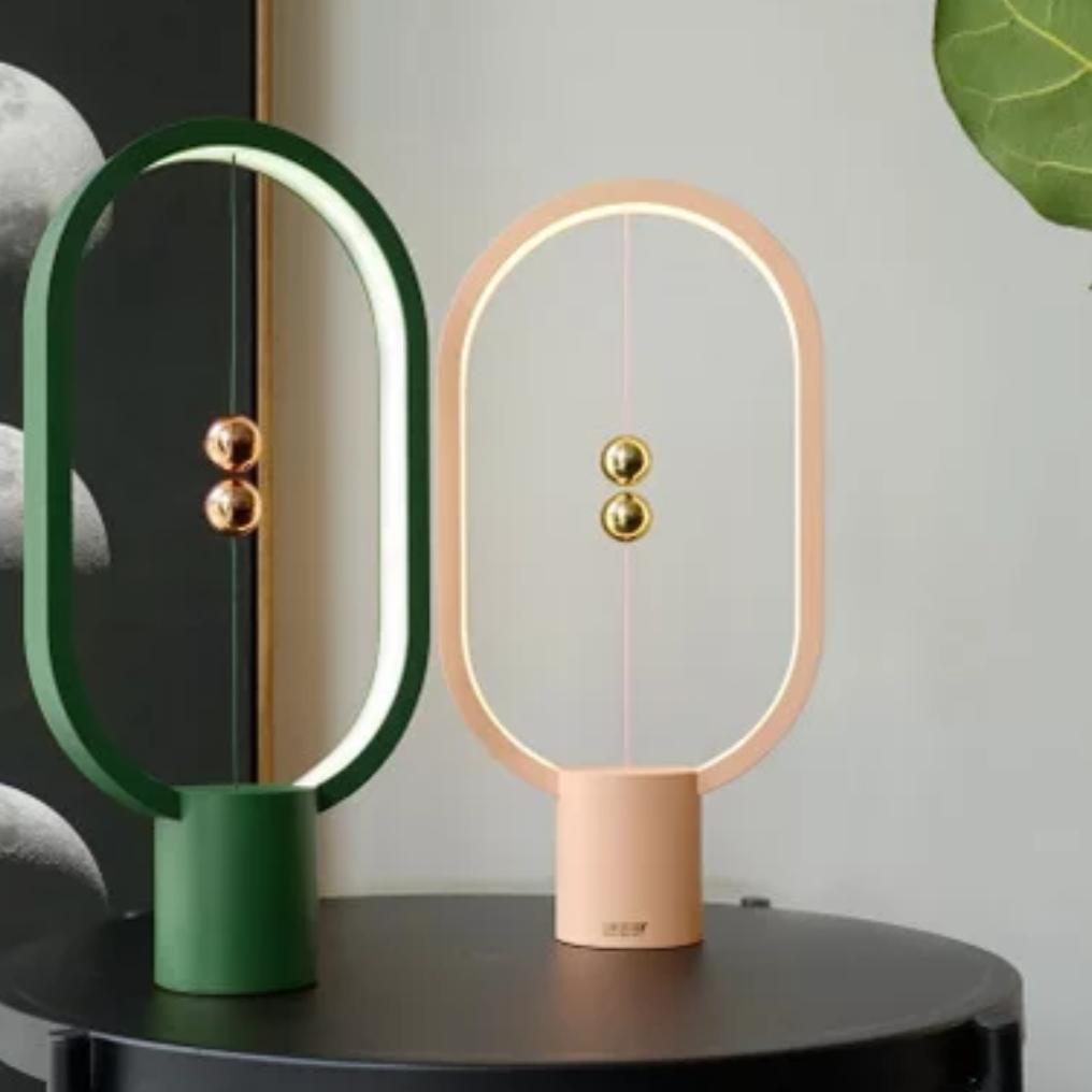 Minimalist LED desk lamp with balance design & magnetic floating switch. Perfect for office.