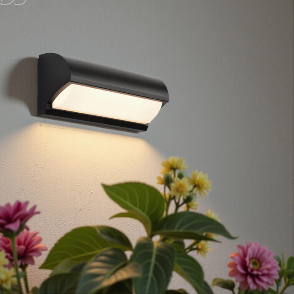 Weatherproof black LED outdoor light, modern design for garden & patio. Energy efficient.