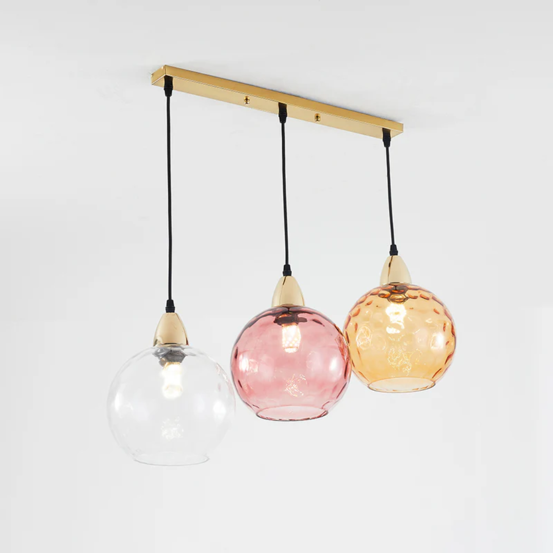 Modern 3-light cascade pendant, designer quality ceiling fixture for elegant home decor.