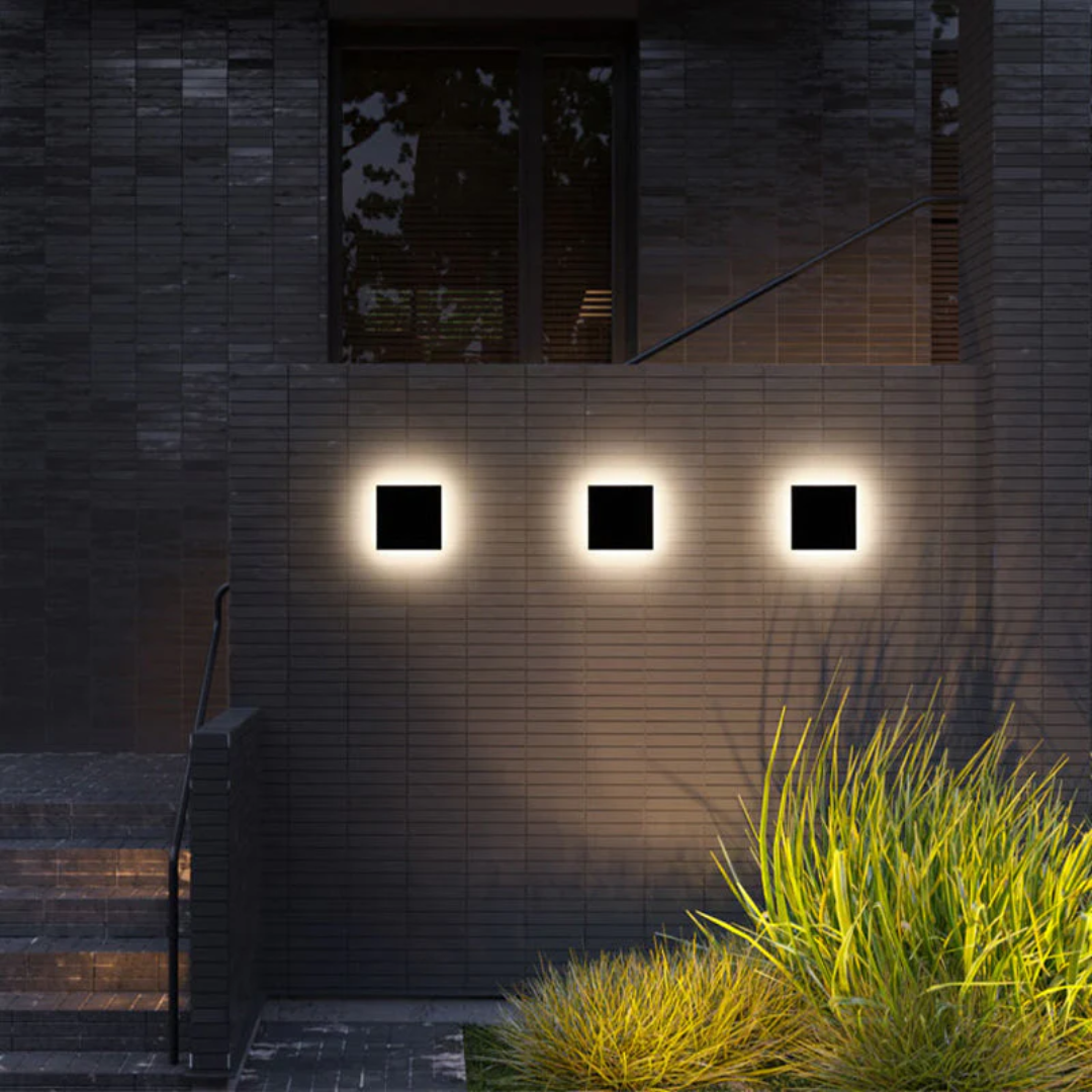 Zenith LED wall lamp enhancing a modern garden path, energy-efficient outdoor lighting solution.