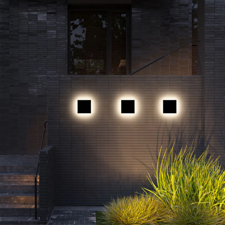 Zenith LED wall lamp enhancing a modern garden path, energy-efficient outdoor lighting solution.