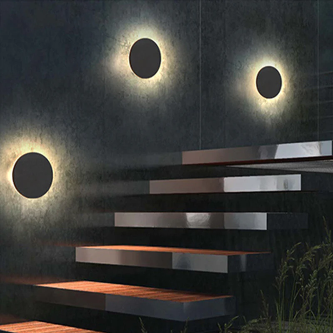 Zenith modern LED wall lamp casting a clean, bright light on an exterior wall, minimalist design.