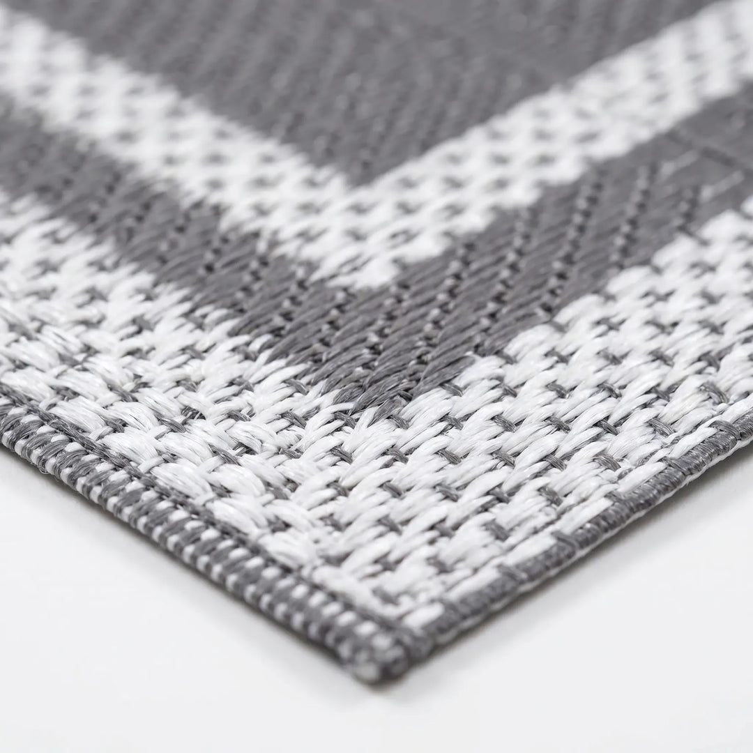 Portable grey white geometric outdoor mat for camping & picnics. Easy-clean modern patio & deck decor. Reversible floor covering.