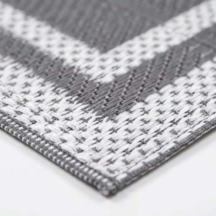 Portable grey white geometric outdoor mat for camping & picnics. Easy-clean modern patio & deck decor. Reversible floor covering.
