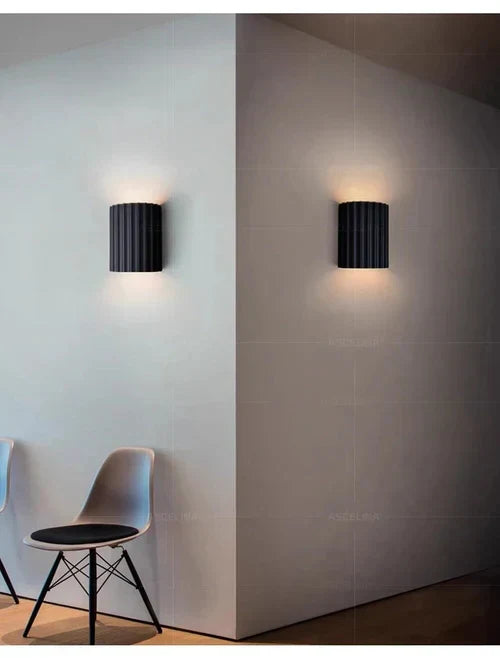 Stylish modern wall lamp with unique wave design, enhancing any home decor with sophisticated light.