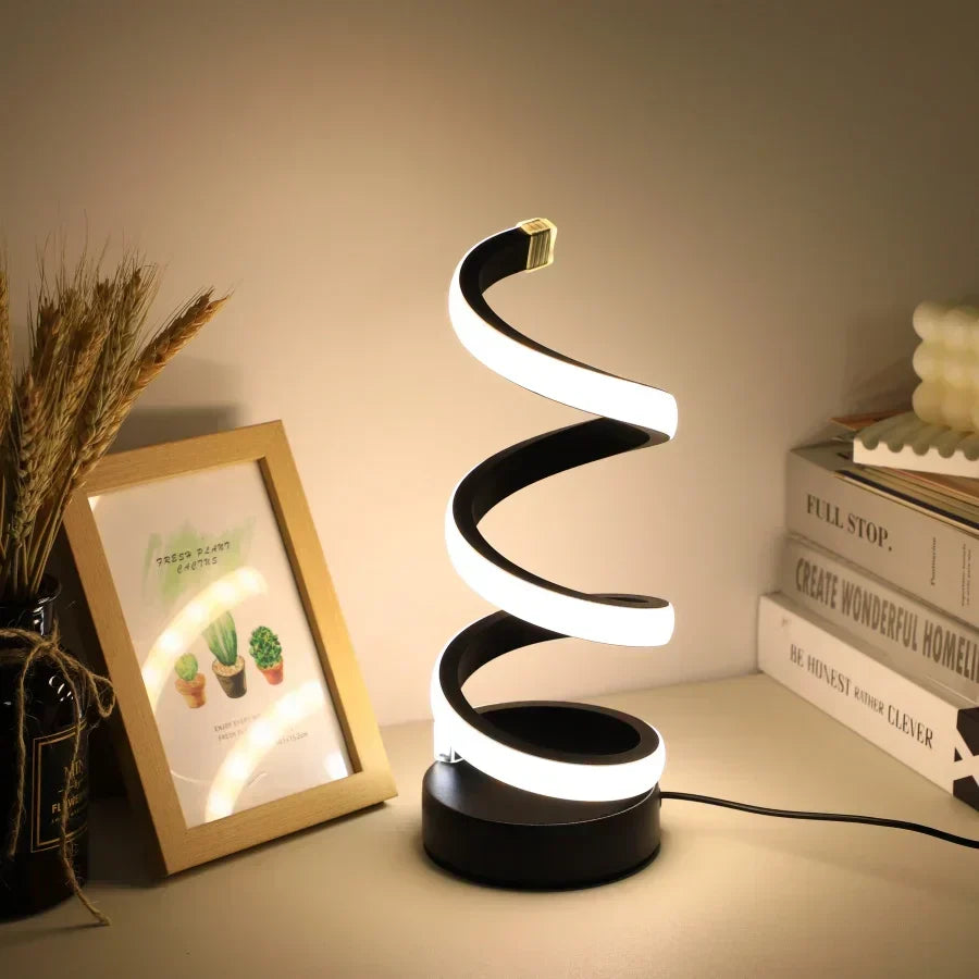 Sleek black S-shaped LED desk lamp, USB powered for flexible modern office lighting. Eye care technology.