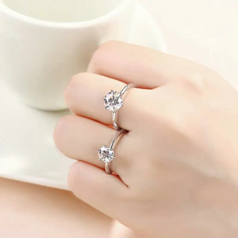 Brilliant Cut Moissanite women's engagement ring, VVS1 gemstone, sterling silver band.