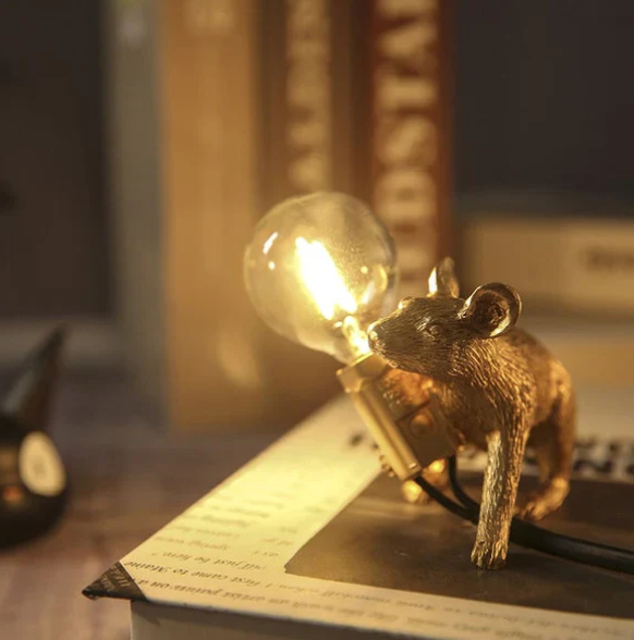 Decorative gold mouse lamp, a unique table lamp & accent light; perfect gift for whimsical home decor lovers.