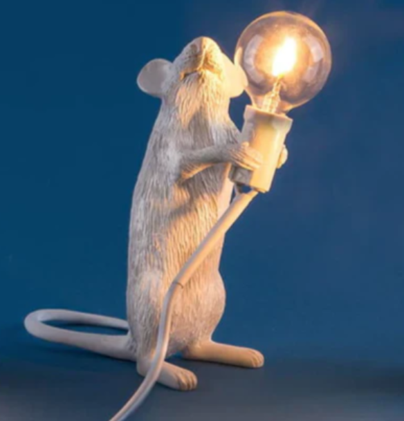 Playful mouse table lamp, providing charming accent light; ideal for whimsical home and unique animal decor.