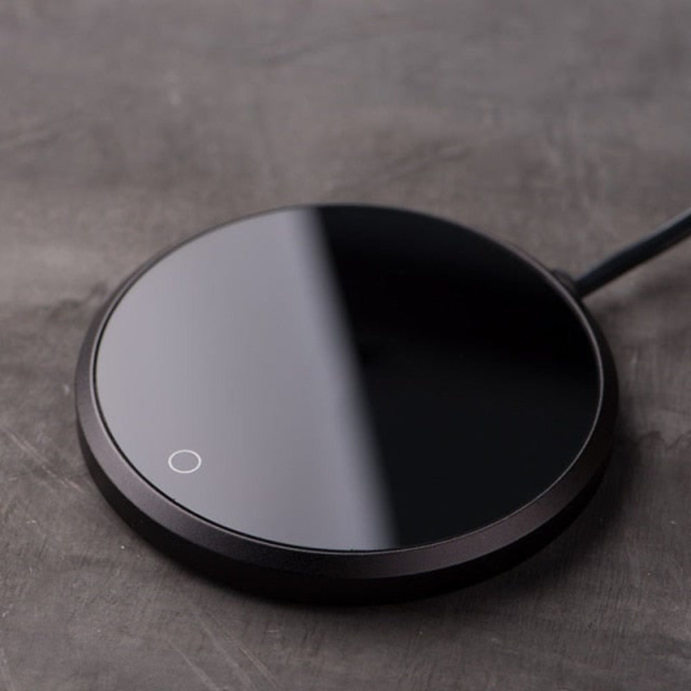 Desk accessory: electric mug warmer for home office. Enjoy hot coffee or tea with auto shut-off.