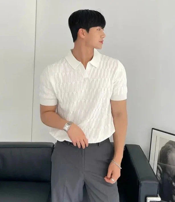 Black muscle fit men's polo, short sleeve, ideal for a sleek, smart casual outfit.