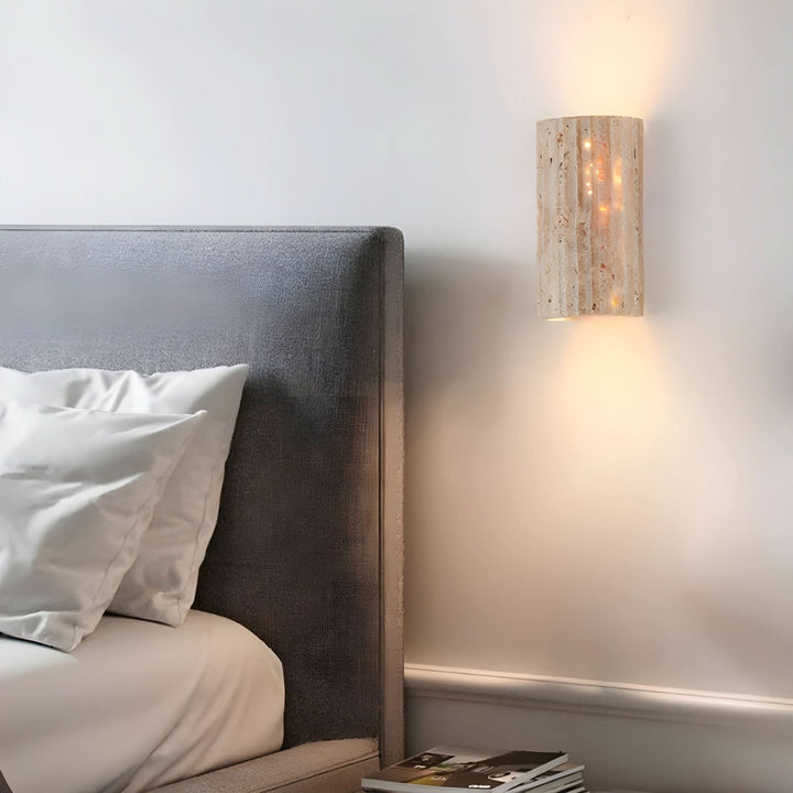 Elegant natural stone wall sconce with a warm LED glow, perfect for contemporary home decor.