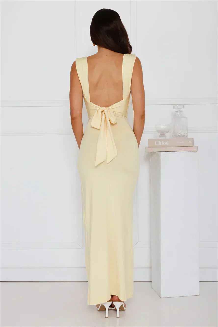 Full-length view of the elegant maxi dress highlighting its high side split and long, flowing design.
