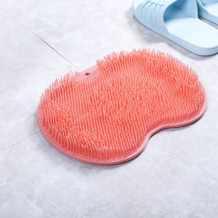 Non-slip silicone shower mat with integrated foot scrubber for safe, clean feet.