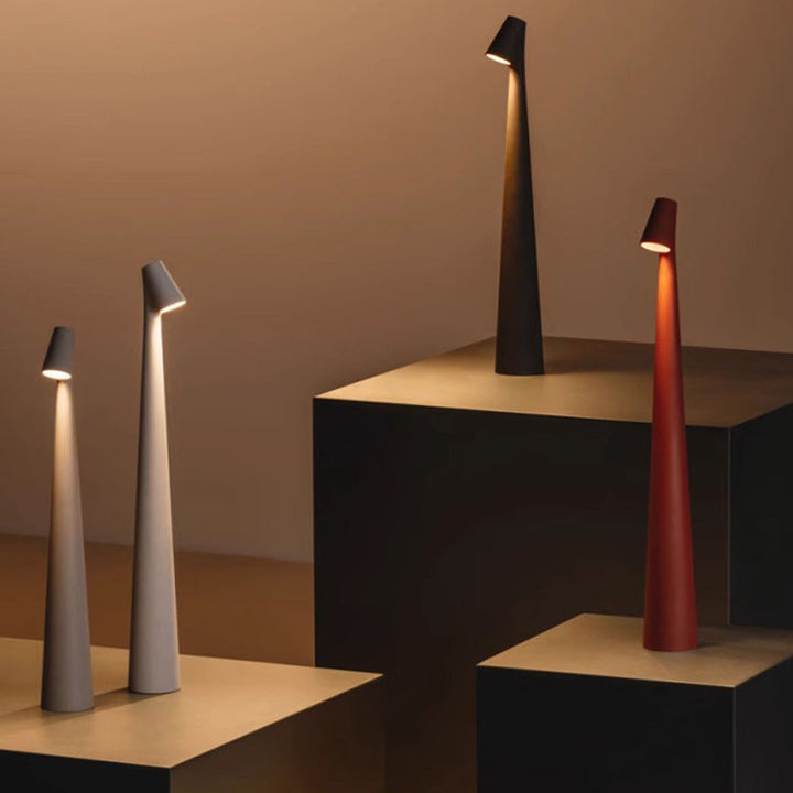 Minimalist wireless LED table lamp with dimmable ambient light. Perfect portable modern home decor.