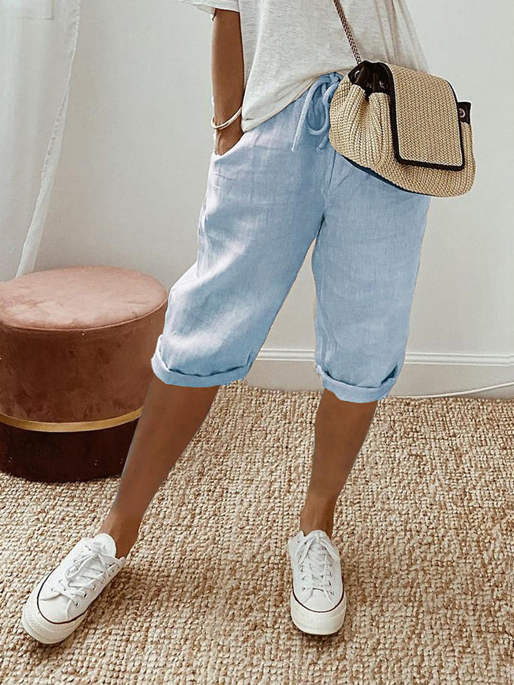Ladies' comfortable versatile shorts with adjustable drawstring waist and side pockets for daily wear.