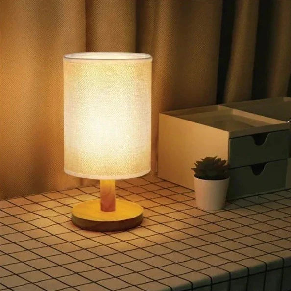 Nvroome Lights Dimmable Table Lamp, casting an organic glow. A chic wood lamp for a serene bedroom atmosphere.