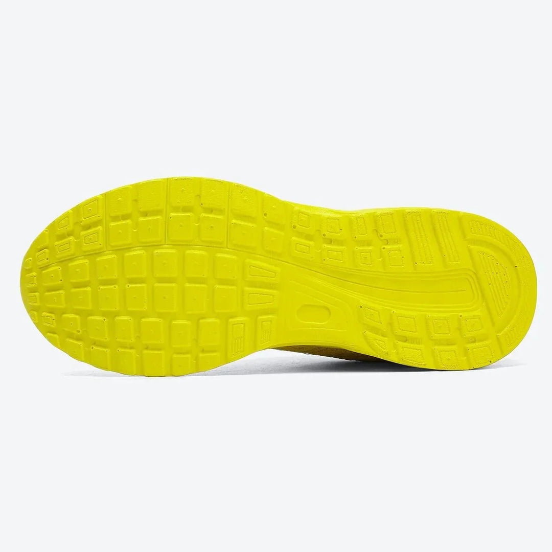 Yellow athletic air cushion walking footwear for women.