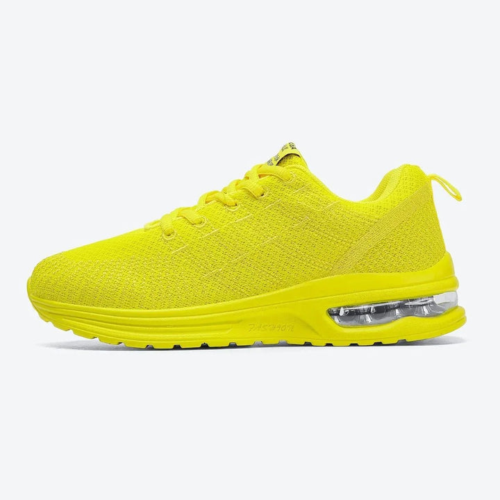 Yellow women's air cushion walking sneakers, comfortable & stylish.