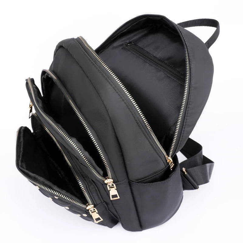 Black lightweight nylon backpack for women, water-resistant for school, daily use & convenient travel.