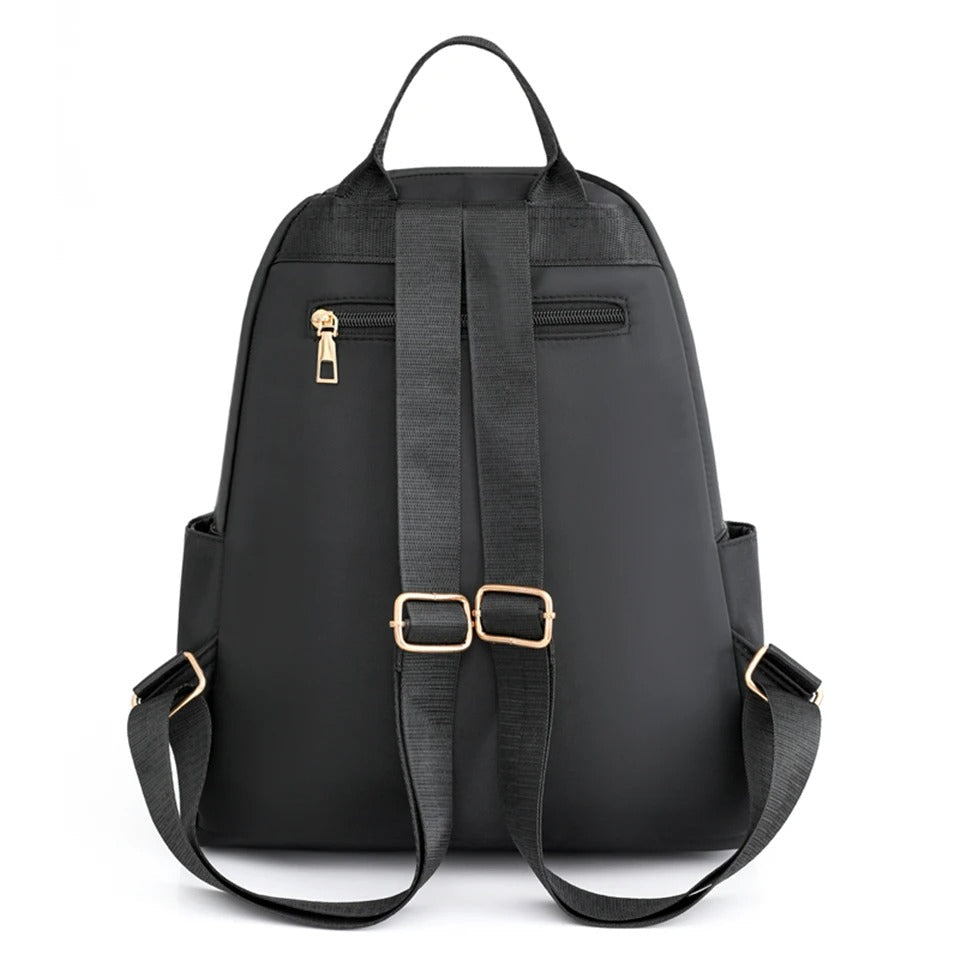 Durable black water-resistant nylon backpack for women, great for school, travel, and everyday carrying.