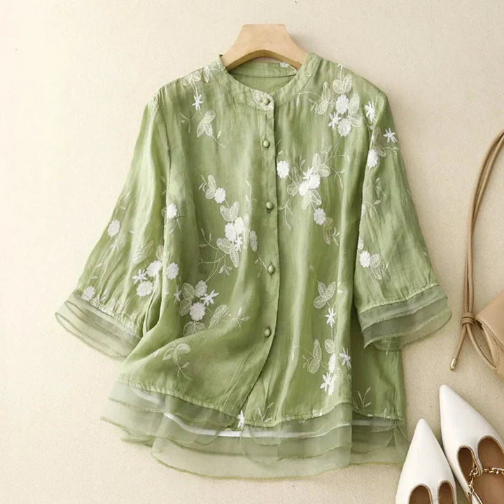 Elegant yet casual women's floral embroidered blouse. Loose fit & comfortable for everyday style.