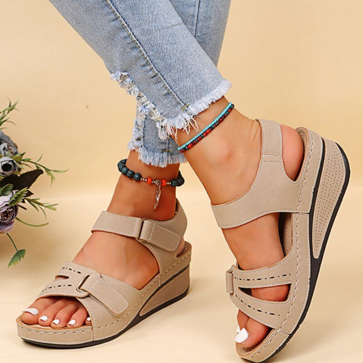Woman enjoying a long walk in Odette orthopedic sandals, ultimate comfort for summer outdoor activities.