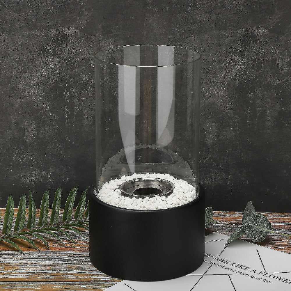Sleek modern tabletop oil lamp with a stone base, perfect for creating ambient indoor lighting and decor.