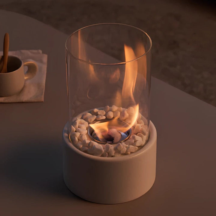 Modern glass & metal tabletop oil lamp with sleek stone base for stylish home decor.